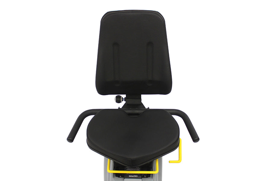 Black padded seat and backrest on PhysioStep LXT recumbent elliptical with yellow accents, viewed from front on white backgro
