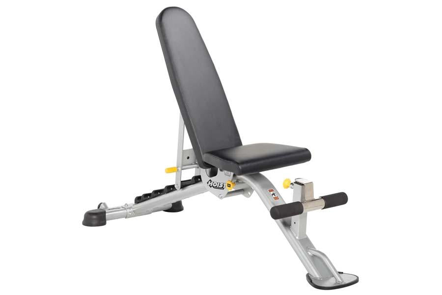 Adjustable weight bench with black padded seat and backrest, silver metal frame with yellow accents and leg extension attachm