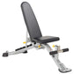Hoist adjustable weight bench with black padded seat and backrest, silver frame, leg extension attachment, and yellow adjustm