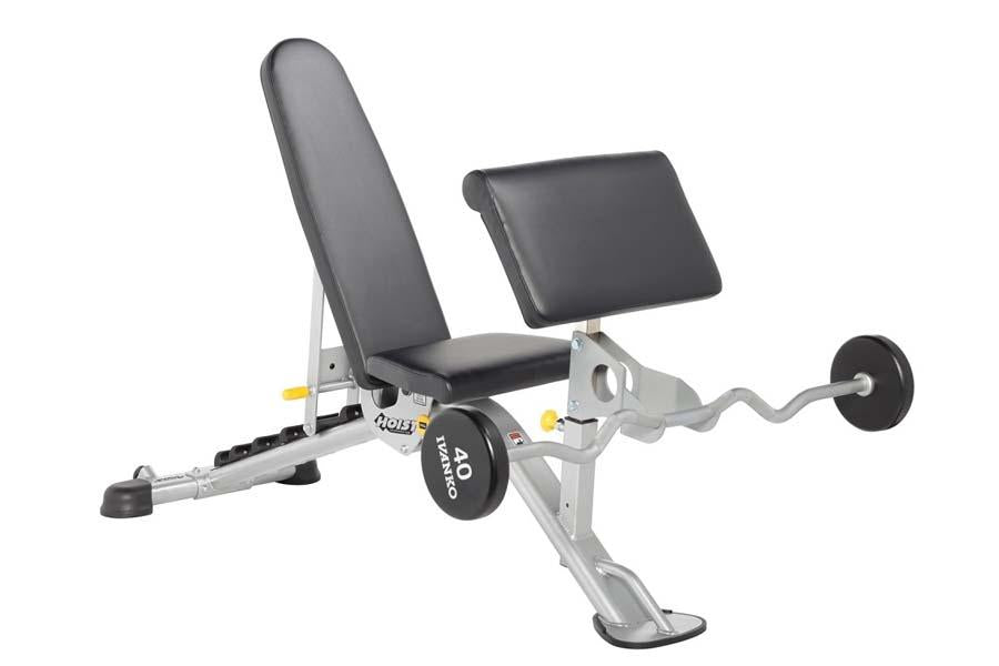 White and black weight bench with adjustable backrest and leg extension attachment on white background