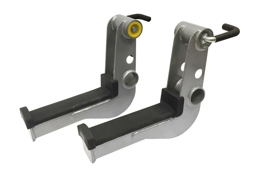 Pair of gray and black metal squat rack arms with rubber grips and adjustment levers, flat lay view