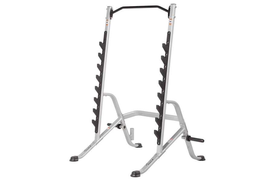 Hoist multi-purpose squat rack with silver frame, black curved top bar, and black rubber-coated dumbbell holders on vertical 