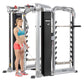 Hoist Mi7Smith functional training system with silver frame and black panels, woman demonstrating pec fly exercise on white b