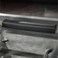 Black leather handle pad on gray metal frame of squat machine