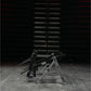 Hammer Strength Ground Base Multi-Squat Machine with black and gray metal frame on concrete floor in gym setting