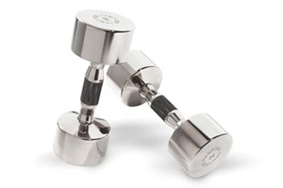 Pair of chrome dumbbells with black contoured grips on white background