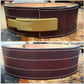 Dark brown leather weightlifting belt with brass lever buckle and white contrast stitching, shown front and back views