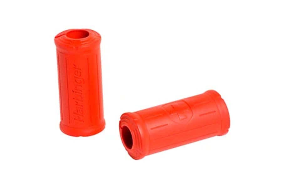 Warrior Big Grip Bar Grips in bright red rubber, cylindrical design with textured surface, shown in upright and angled views 
