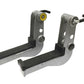 Pair of gray and black metal hoist safety tier attachments with yellow and silver pulleys, black levers, and rubber grips, sh
