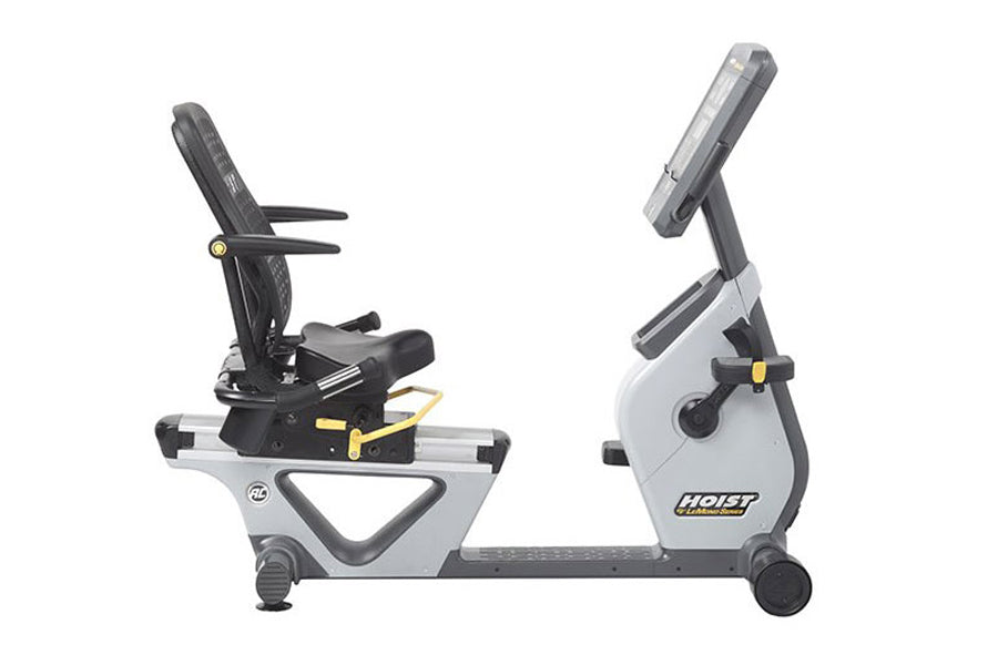 Hoist Lemond Series RC recumbent exercise bike with white frame, black padded seat, adjustable backrest, armrests, and digita