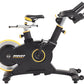 Black and yellow stationary exercise bike with adjustable handlebars, padded seat, and large weighted flywheel on white backg