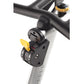Black and gray stationary bike handlebar with yellow adjustment lever and digital control panel mounted on white stem, close-