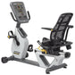 Hoist Lemond Series RC recumbent exercise bike with white and black frame, digital display console, and perforated mesh backr