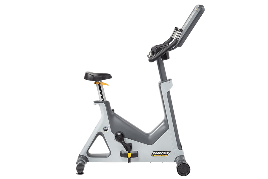 Hoist Lemond Series UC upright exercise bike with gray frame, black seat, and digital console on white background