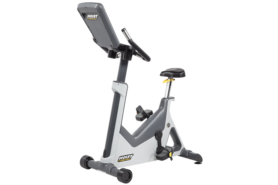 Hoist Lemond Series UC upright exercise bike with gray frame, black seat, and digital console on white background