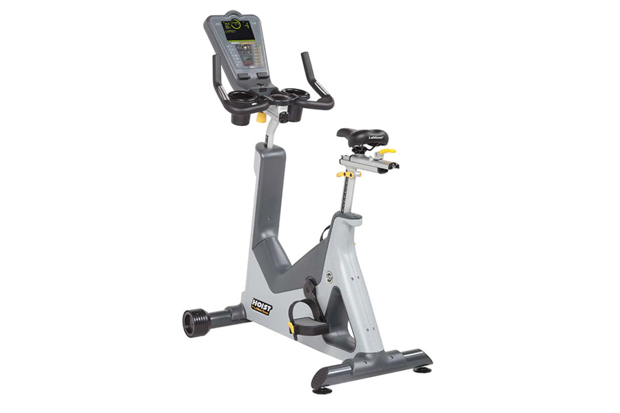 Hoist Lemond Series UT upright exercise bike with gray frame, black seat and handlebars, digital console display, and yellow 