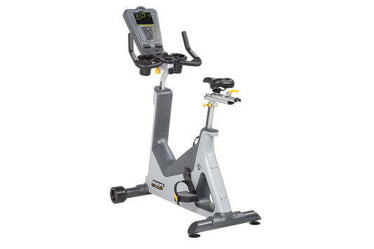 Hoist Lemond Series UT upright exercise bike with gray frame, black seat and handlebars, digital console display, and yellow 