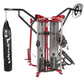 Red and black Hoist MCS-8005 multi-station gym equipment with boxing heavy bag attachment on left arm, displayed on white bac