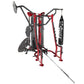 Red and black multi-station gym equipment with punching bag, pull-up bar, and leg press on white background