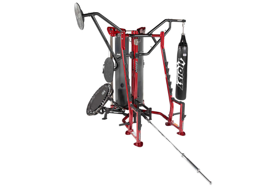 Red and black multi-station gym equipment with punching bag, pull-up bar, and leg press on white background