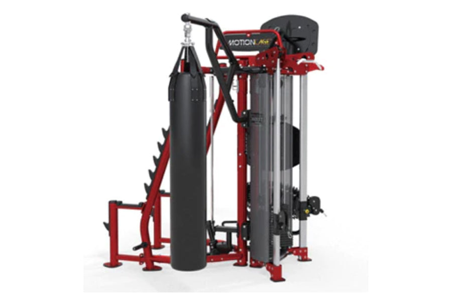 Red and black Hoist MCS-8005 Motioncage Studio Package with dual weight stacks, heavy bag attachment, and handlebar grips on 