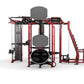 Red and black multi-station gym equipment with gray padded seats, cable machines, and leg press on white background