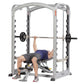 Man using silver and black Hoist Smith Machine with barbell for bench press exercise on white background