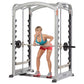 Silver and black dual action Smith machine with woman in teal top and pink shorts performing barbell exercise, on white backg