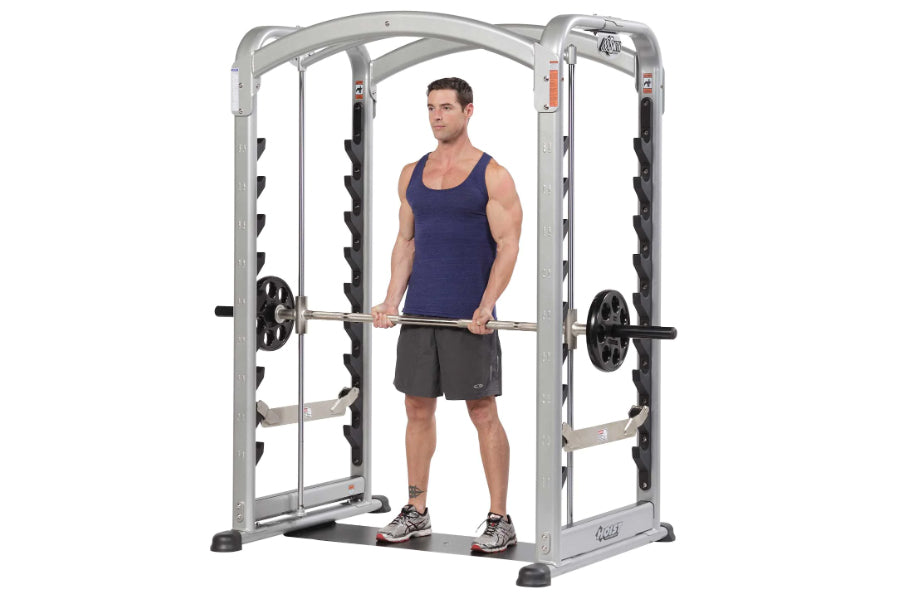 Man using silver smith machine with adjustable barbell, displayed on white background