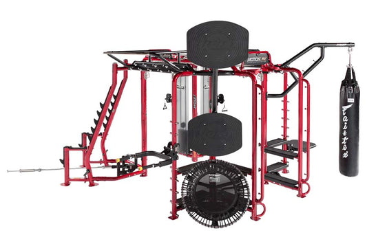 Red and black multi-station gym rig system with cable machines, pull-up bar, heavy bag attachment, and leg press station on w