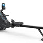 Black Horizon Oxford 6 rowing machine with digital display console, adjustable seat, and extended footrest on white backgroun