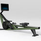 Hydrow Wave rowing machine with sage green frame, black details, digital display monitor, and black seat on white background