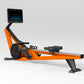 Hydrow Wave rowing machine with orange and black frame, digital touchscreen monitor, and black foot platform on white backgro
