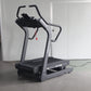 Commercial grade treadmill with black and gray frame, curved handles, and digital display showing "CFIT8" model in gym settin