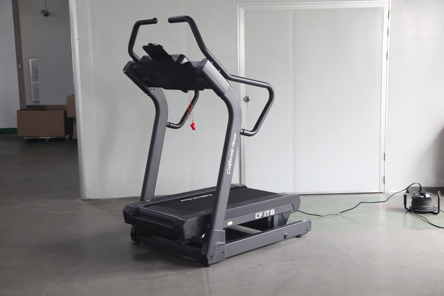 Commercial grade treadmill with black and gray frame, curved handles, and digital display showing "CFIT8" model in gym settin
