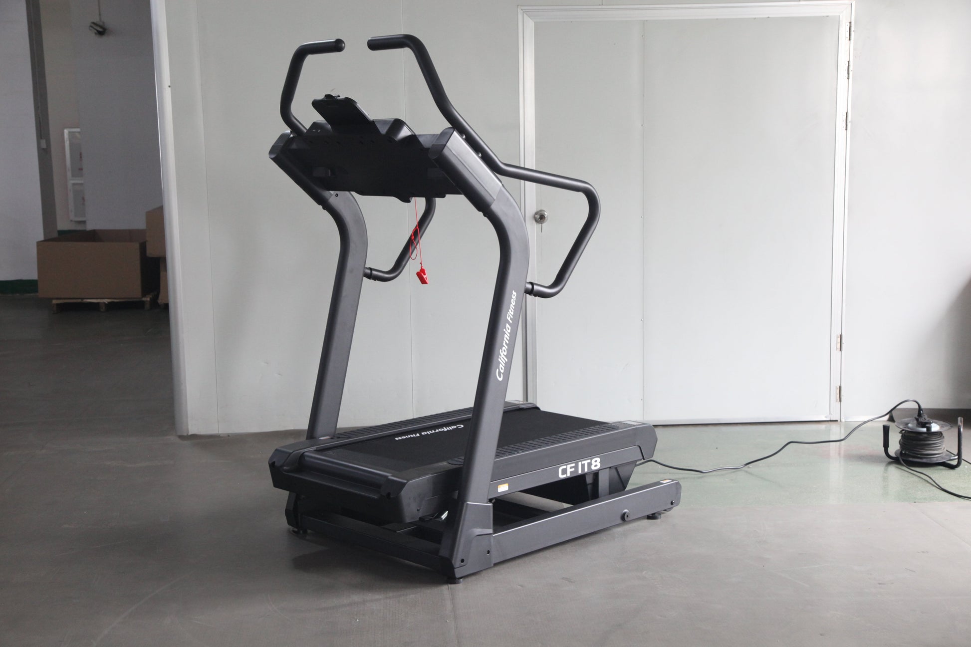 Commercial grade treadmill with black and gray frame, curved handles, and digital display showing "CFIT8" model in gym settin