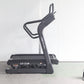 Black motorized treadmill with curved running deck and dual handlebar grips, model CF IT8, on white background with power cor
