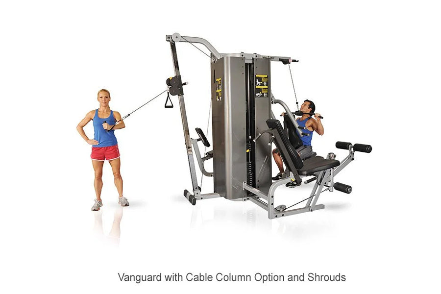 Inflight Vanguard 2-stack multi-gym with cable column and shrouds, shown with two models demonstrating lat pulldown and leg p