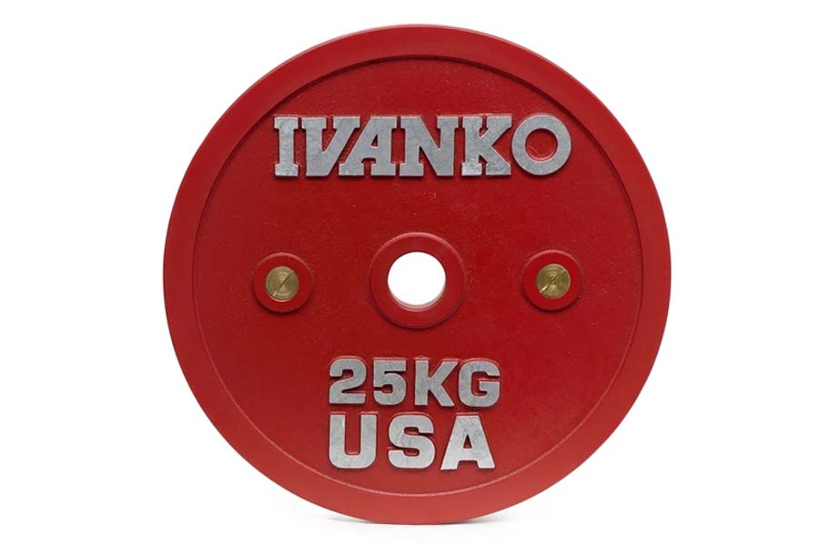 Red 25kg Ivanko bumper plate with silver text and brass bushings, flat lay on white background