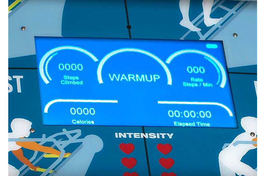 Jacobs Ladder X climbing machine display screen showing workout metrics including steps climbed, warmup status, heart rate, c