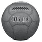 Charcoal gray 6-pound slam ball with textured surface, white "06 LB" text, and black X-stitch detail on white background