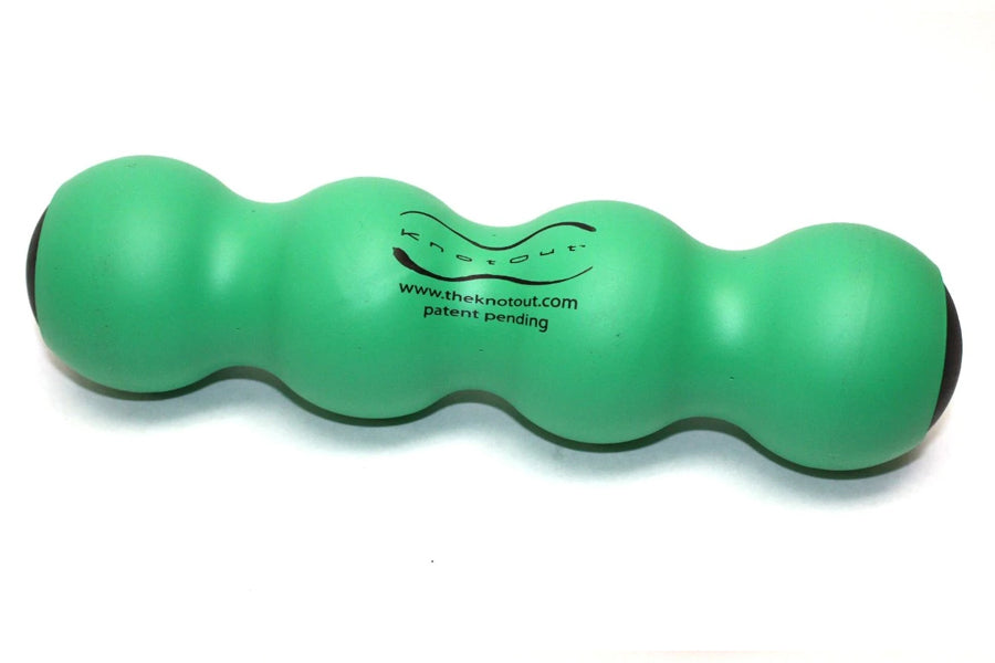 Green peanut-shaped massage roller with wavy contours and black grip ends, shown on white background