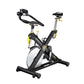 Black and yellow stationary indoor cycling bike with white wheel, padded seat, and adjustable handlebars on white background