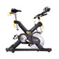 Black and silver stationary indoor cycling bike with yellow accents, adjustable seat and handlebars, digital console, on whit