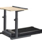 Treadmill desk with natural wood top surface and black metal frame, featuring adjustable height legs and built-in black tread