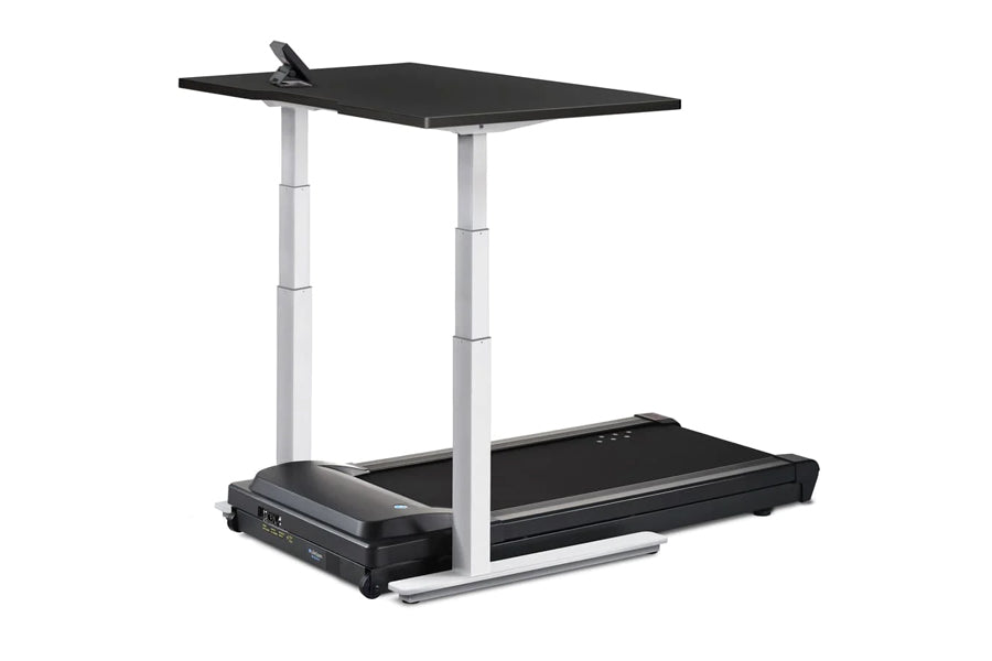 LifeSpan TR1000-Omni Desk Treadmill with black running surface, white adjustable height columns, and black desktop on white b