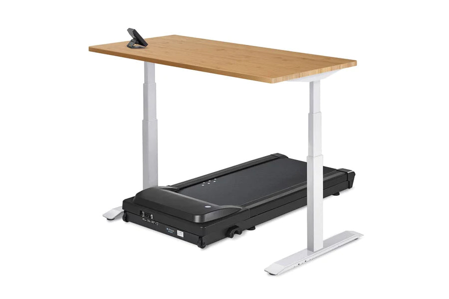 Height-adjustable standing desk with natural wood top and white frame, integrated with black LifeSpan treadmill underneath, o