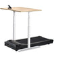 Adjustable height standing desk with light wood top and silver metal frame mounted above black treadmill base