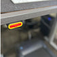 Red and yellow illuminated control button on underside of LifeSpan treadmill desk