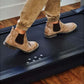 Tan suede Chelsea boots with elastic side panels worn by model on LifeSpan treadmill desk